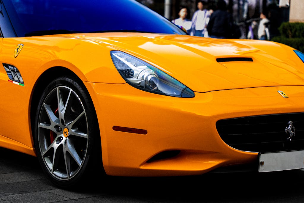 A ferrari parked on the street in front of a building