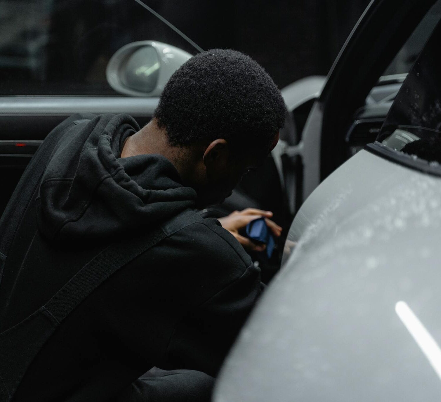 Man in Black Jacket Driving Car